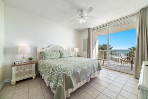 a bedroom with a bed and a view of the ocean at Beach Club D-506 Beachfront-Tons of Amenities-3-Restaurants-Incredible Views in Gulf Shores