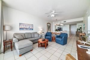 a living room with a couch and chairs and a table at Beach Club D-506 Beachfront-Tons of Amenities-3-Restaurants-Incredible Views in Gulf Shores +66 photos