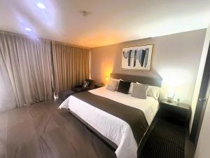 Voodi või voodid majutusasutuse Arboleda 5 Luxury Lofts toas