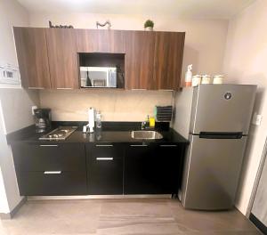 Köök või kööginurk majutusasutuses Arboleda 5 Luxury Lofts
