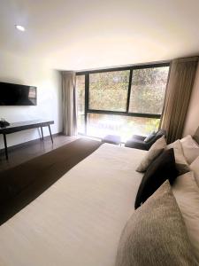Voodi või voodid majutusasutuse Arboleda 5 Luxury Lofts toas