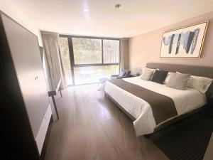 Voodi või voodid majutusasutuse Arboleda 5 Luxury Lofts toas
