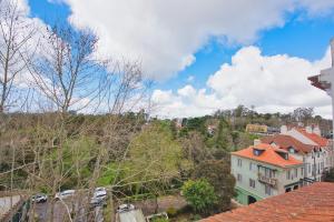 a view of a city with houses and trees at Monte da Lua in Sintra