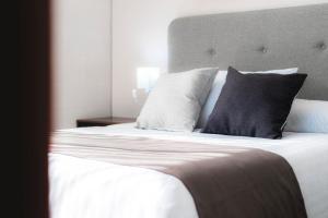 Voodi või voodid majutusasutuse Arboleda 5 Luxury Lofts toas