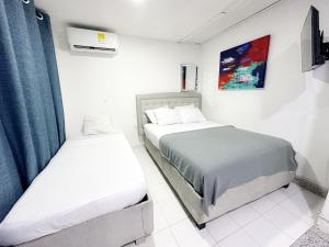 Postel nebo postele na pokoji v ubytování Hotel CasaBlanca Cartagena