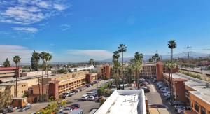 an aerial view of a city with palm trees and buildings at Grand Legacy At The Park in Anaheim
