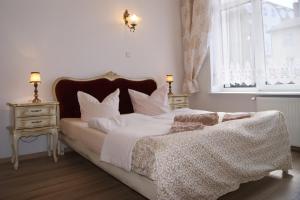 Postel nebo postele na pokoji v ubytování Villa Amadea