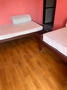 Postel nebo postele na pokoji v ubytování Bindabasini Home NO-9