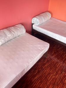 Postel nebo postele na pokoji v ubytování Bindabasini Home NO-9