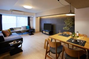TV a/nebo společenská místnost v ubytování Minn Kitahiroshima Station East