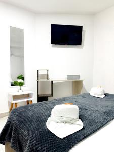 Postel nebo postele na pokoji v ubytování Hotel CasaBlanca Cartagena