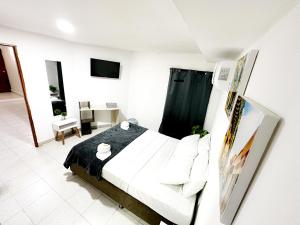 Postel nebo postele na pokoji v ubytování Hotel CasaBlanca Cartagena
