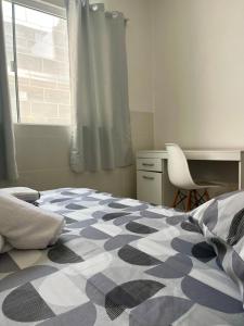Ένα ή περισσότερα κρεβάτια σε δωμάτιο στο Casa com salão de festas 7km da praia +6 φωτογραφίες