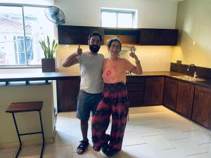 a man and a woman standing in a kitchen at Hidden Negombo By Sana's in Negombo +18 photos