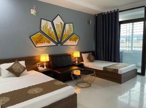 Ένα ή περισσότερα κρεβάτια σε δωμάτιο στο Khách sạn Hải An Quế Võ