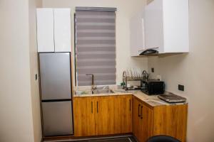 Kuhinja oz. manjša kuhinja v nastanitvi C33 Apartment and Suites