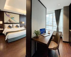 Voodi või voodid majutusasutuse Kaili Shimao Hotel toas