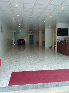 a large room with a car parked in a building at thieuki 1 in Hà Tĩnh