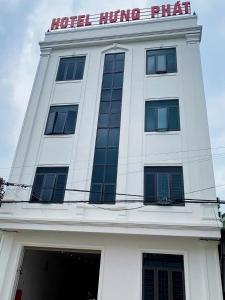 a white building with a sign on top of it at thieuki 1 in Hà Tĩnh