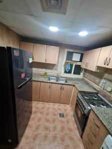 Η κουζίνα ή μικρή κουζίνα στο سكن شباب بالتعاون - ALEX Hostel - Sharjah