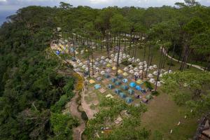 an aerial view of a park with umbrellas and trees at Camping Park Resort by EHM in Kampong Seila