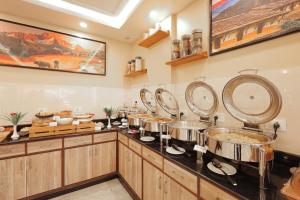 A cozinha ou kitchenette de Magnificent Hotel