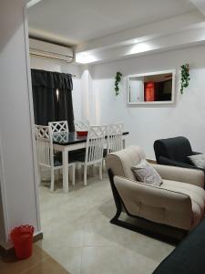 a living room with a couch and a table at Cozy Villa in Hurghada