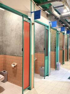 a bathroom with several toilets in a building at The Urbanists BKK Entire Floor 4-6 people 4Beds 4Baths near Medpark Hospital , Queen Sirikit Convention hall , Benjakitti Park in Bangkok