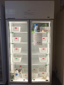 a refrigerator with its door open with food inside at Hay Street Traveller's Inn in Perth