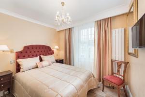 Cama o camas de una habitación en London Residence
