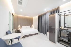 Cheomdan Lantana Hotel客房内的一张或多张床位