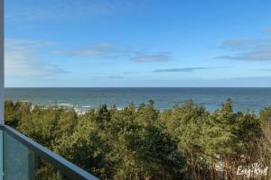 a view of the ocean from the balcony of a condo at Prestige Pinea 613 - basen, sauna, jacuzzi w cenie pobytu - Easy - Rent Apartments in Pobierowo
