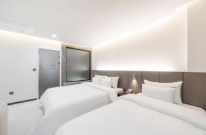 Cheomdan Lantana Hotel客房内的一张或多张床位