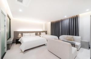 Cheomdan Lantana Hotel客房内的一张或多张床位