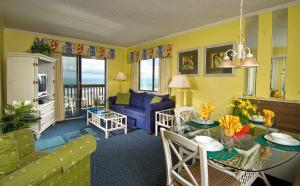 a living room with a couch and a table at Ocean Forest Colony by Capital Vacations in Myrtle Beach