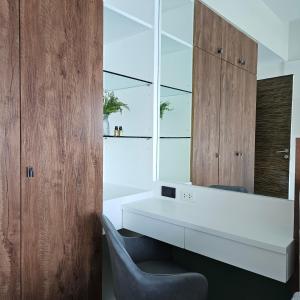 a bathroom with a white desk and a chair at Patong Tower Apartment Family Room See View in Patong Beach