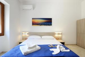 Postel nebo postele na pokoji v ubytování B&B Adriana