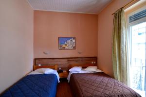 Postel nebo postele na pokoji v ubytování Electra Hotel Piraeus