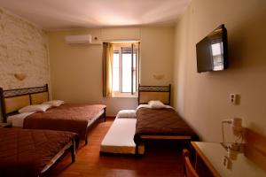 Postel nebo postele na pokoji v ubytování Electra Hotel Piraeus