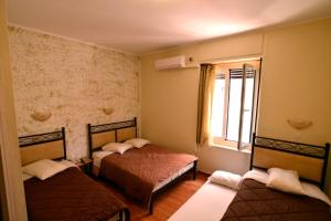 Postel nebo postele na pokoji v ubytování Electra Hotel Piraeus
