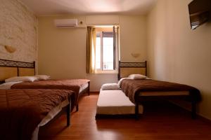 Postel nebo postele na pokoji v ubytování Electra Hotel Piraeus