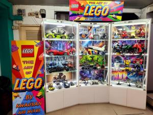 a lego display case with toys in it at Khaosan Art Hotel in Bangkok