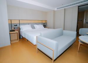 Postel nebo postele na pokoji v ubytování 曼谷东方酒店