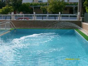 a pool with water spraying into the air at Angels Inn Marmaris in Marmaris