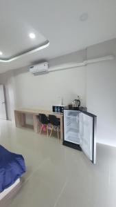 A bed or beds in a room at หลังมอ บิวตี้ อพาร์ตเมนต์