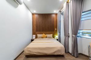 Postel nebo postele na pokoji v ubytování căn hộ 72 chi lăng