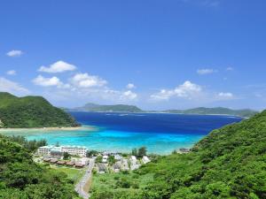 a view of the ocean and a resort at Tokashiku Marine Villege in Tokashiki