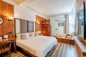 Letto o letti in una camera di Pillow Window & Listen to Rain Hostel Museum Branch Pingjiang Road, Suzhou