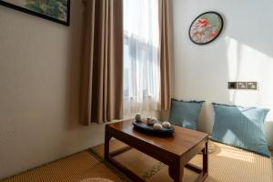 Area soggiorno di Pillow Window & Listen to Rain Hostel Museum Branch Pingjiang Road, Suzhou