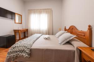 Cama o camas de una habitación en Pensión Casa Castelao 31 O Grove